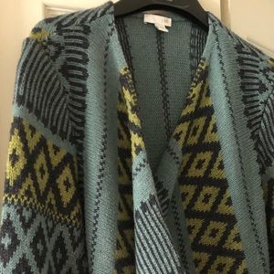 Beautiful long sweater with bold pattern.